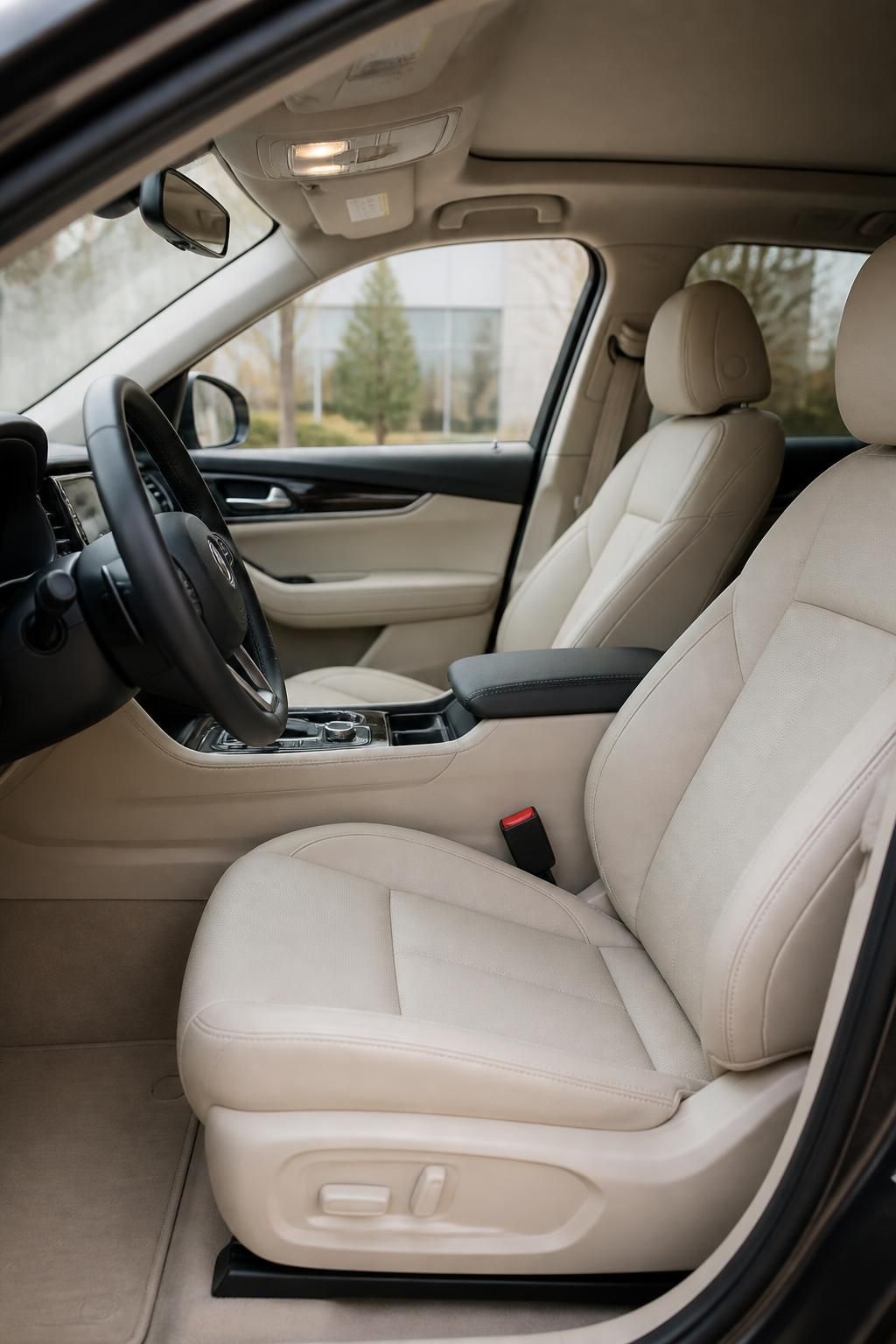 Clean detailing bay showing a polished vehicle interior and finished surfaces.