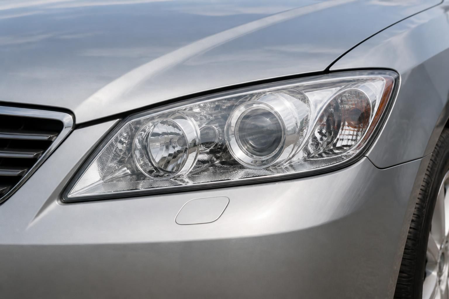 Restored car headlights with clear lenses and a clean front end.